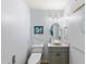Modern powder room with vessel sink, updated fixtures, and coastal decor at 8035 Manasota Key Rd, Englewood, FL 34223
