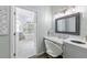 Main bathroom with freestanding tub and double vanity at 8035 Manasota Key Rd, Englewood, FL 34223