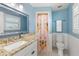 Guest bathroom with flamingo shower curtain and granite vanity at 8035 Manasota Key Rd, Englewood, FL 34223