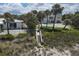 Beach access with wooden steps leading to the sand at 8035 Manasota Key Rd, Englewood, FL 34223