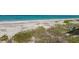 Beachfront view with teal water and sandy beach at 8035 Manasota Key Rd, Englewood, FL 34223