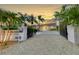 Elegant home with gated entry and meticulously landscaped grounds at 8035 Manasota Key Rd, Englewood, FL 34223