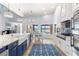 Modern kitchen features stainless steel appliances and a lovely water view at 8035 Manasota Key Rd, Englewood, FL 34223