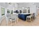 Modern kitchen with a large island, stainless steel appliances, and a breakfast nook at 8035 Manasota Key Rd, Englewood, FL 34223