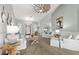 Bright living room with vaulted ceilings, comfy seating, and a coastal decor at 8035 Manasota Key Rd, Englewood, FL 34223
