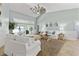 Bright and airy living room with vaulted ceilings, featuring comfortable seating and water views at 8035 Manasota Key Rd, Englewood, FL 34223