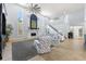 Living room with high ceilings, fireplace, and a stylish seating arrangement at 8035 Manasota Key Rd, Englewood, FL 34223