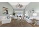 Spacious living room with vaulted ceiling, neutral decor, and access to the waterfront at 8035 Manasota Key Rd, Englewood, FL 34223