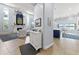 Two-story living room with a fireplace and an open floor plan leading to the kitchen at 8035 Manasota Key Rd, Englewood, FL 34223