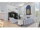 Living room featuring a large TV, comfortable seating, and coastal decor at 8035 Manasota Key Rd, Englewood, FL 34223