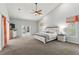 Main bedroom with king bed and access to pool area at 8035 Manasota Key Rd, Englewood, FL 34223