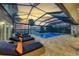 Inviting pool and spa area with covered lanai, offering tranquil water views at 8035 Manasota Key Rd, Englewood, FL 34223