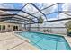 Relaxing pool area with screened enclosure and beautiful water views at 8035 Manasota Key Rd, Englewood, FL 34223