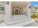 Elegant portico with double doors and columns at 8035 Manasota Key Rd, Englewood, FL 34223