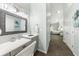 Main bathroom vanity with grey cabinets and quartz countertop at 8035 Manasota Key Rd, Englewood, FL 34223