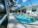 Relaxing kidney shaped pool with screened enclosure at 133 Wahoo Dr, Rotonda West, FL 33947