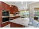 Gourmet kitchen with stainless steel appliances and granite countertops at 8074 Wiltshire Dr, Port Charlotte, FL 33981