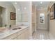 Bathroom with a large vanity, hexagon tile floor, and natural light at 8074 Wiltshire Dr, Port Charlotte, FL 33981