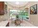 Breakfast nook with pool view and large windows at 8074 Wiltshire Dr, Port Charlotte, FL 33981