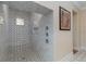 Elegant shower with patterned marble tile and built-in seat at 8074 Wiltshire Dr, Port Charlotte, FL 33981