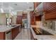 Modern kitchen with stainless steel appliances and granite countertops at 8074 Wiltshire Dr, Port Charlotte, FL 33981