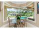 Breakfast nook with pool view and large windows at 8074 Wiltshire Dr, Port Charlotte, FL 33981