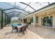 Lush landscaping surrounds this screened pool and patio at 8074 Wiltshire Dr, Port Charlotte, FL 33981