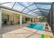 Expansive screened pool and patio with seating area at 8074 Wiltshire Dr, Port Charlotte, FL 33981