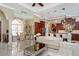Open and bright living room with coffered ceiling and views to kitchen at 8074 Wiltshire Dr, Port Charlotte, FL 33981