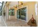 Covered patio with sliding glass doors and pool access at 8074 Wiltshire Dr, Port Charlotte, FL 33981