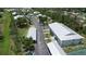 Aerial view showcases community tennis courts and parking at 8050 Memory Ln # 101, Rotonda West, FL 33947
