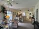 Bright living room with comfy seating and dining area at 8050 Memory Ln # 101, Rotonda West, FL 33947