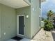 Exterior view of building with green walls at 8050 Memory Ln # 101, Rotonda West, FL 33947