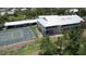 Aerial view of the community, highlighting tennis court and building at 8050 Memory Ln # 101, Rotonda West, FL 33947