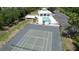 Community pool and tennis court offer resort-style living at 8050 Memory Ln # 101, Rotonda West, FL 33947