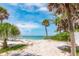 Breathtaking beach view with sand, sky, and surf, a perfect coastal oasis at 6895 Manasota Key Rd, Englewood, FL 34223