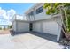 This home boasts a three-car garage and a charming balcony overlooking the beautiful waterside neighborhood at 6895 Manasota Key Rd, Englewood, FL 34223