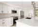 Contemporary kitchen with stainless steel appliances and sleek cabinets at 6895 Manasota Key Rd, Englewood, FL 34223