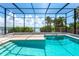 Screened pool area with river views, brick pavers, steps, and ladder at 6895 Manasota Key Rd, Englewood, FL 34223