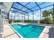Screened pool area with river views, brick pavers, steps, and ladder at 6895 Manasota Key Rd, Englewood, FL 34223