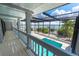 Back patio with screened in pool and waterfront views at 6895 Manasota Key Rd, Englewood, FL 34223