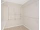 Walk-in closet is equipped with shelving and tile flooring at 6895 Manasota Key Rd, Englewood, FL 34223