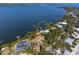 Aerial view of waterfront property with private dock at 6895 Manasota Key Rd, Englewood, FL 34223