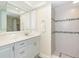 Clean bathroom with white vanity, shower, and mosaic tile at 7446 Palm Island Dr # 3514, Placida, FL 33946