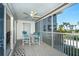 Screened balcony with table and chairs, ocean view at 7446 Palm Island Dr # 3514, Placida, FL 33946