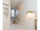 Light and airy hallway with coastal decor and tiled floor at 7446 Palm Island Dr # 3514, Placida, FL 33946