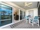 Bright balcony with seating and ocean view at 7446 Palm Island Dr # 3514, Placida, FL 33946