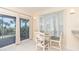 Bright dining area with glass table and ocean view at 7446 Palm Island Dr # 3514, Placida, FL 33946