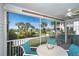 Relaxing screened balcony overlooking ocean and palm trees at 7446 Palm Island Dr # 3514, Placida, FL 33946