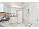 White kitchen boasts granite countertops and updated appliances at 7446 Palm Island Dr # 3514, Placida, FL 33946